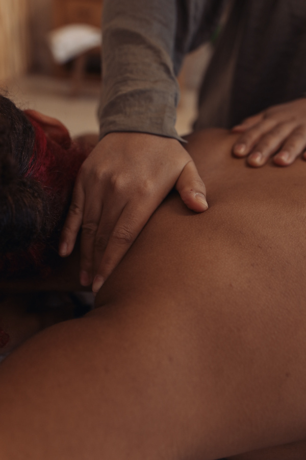Masseuse Massaging Woman's Back